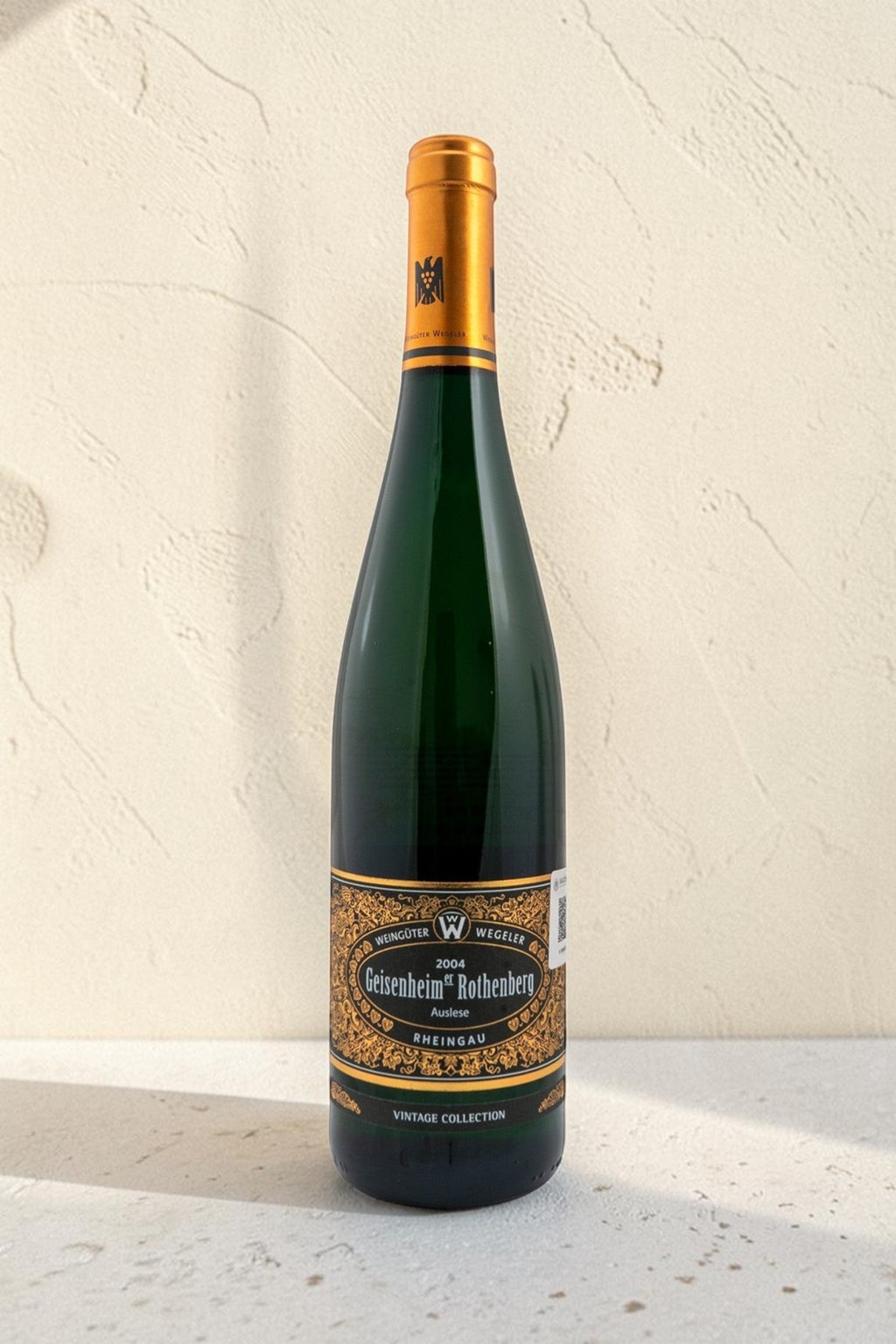 Botella de vino blanco Wellnex Weingut Wegeler Geisenheim Rothenberg Riesling Auslese 2004 con etiqueta elegante