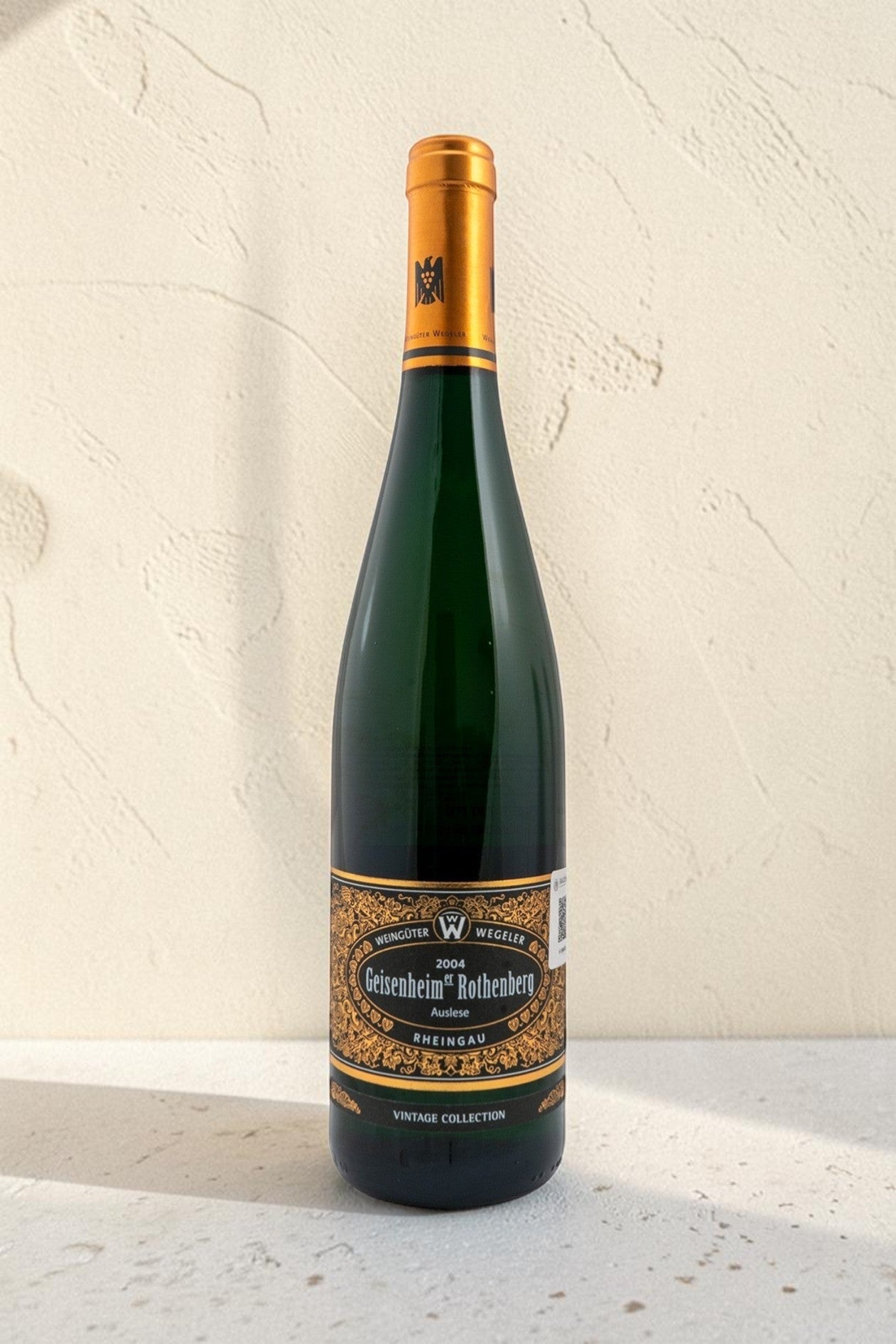 Botella de vino blanco Wellnex Weingut Wegeler Geisenheim Rothenberg Riesling Auslese 2004 con etiqueta elegante