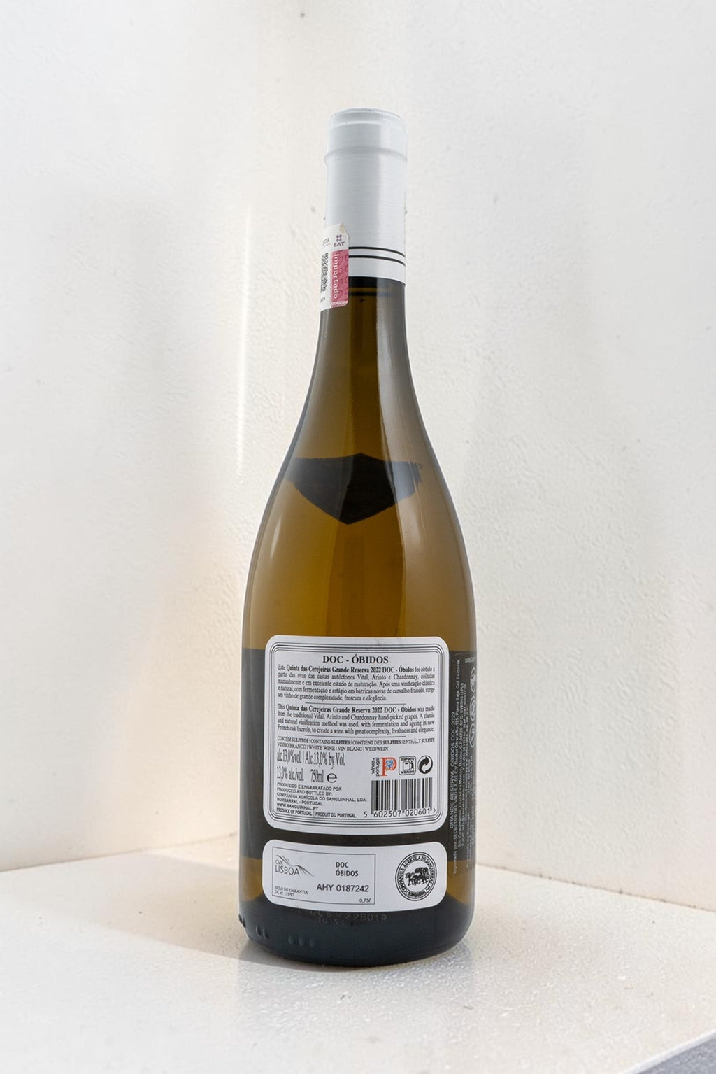 Botella de vino blanco Wellnex Gran Reserva con etiqueta trasera detallada sobre fondo blanco