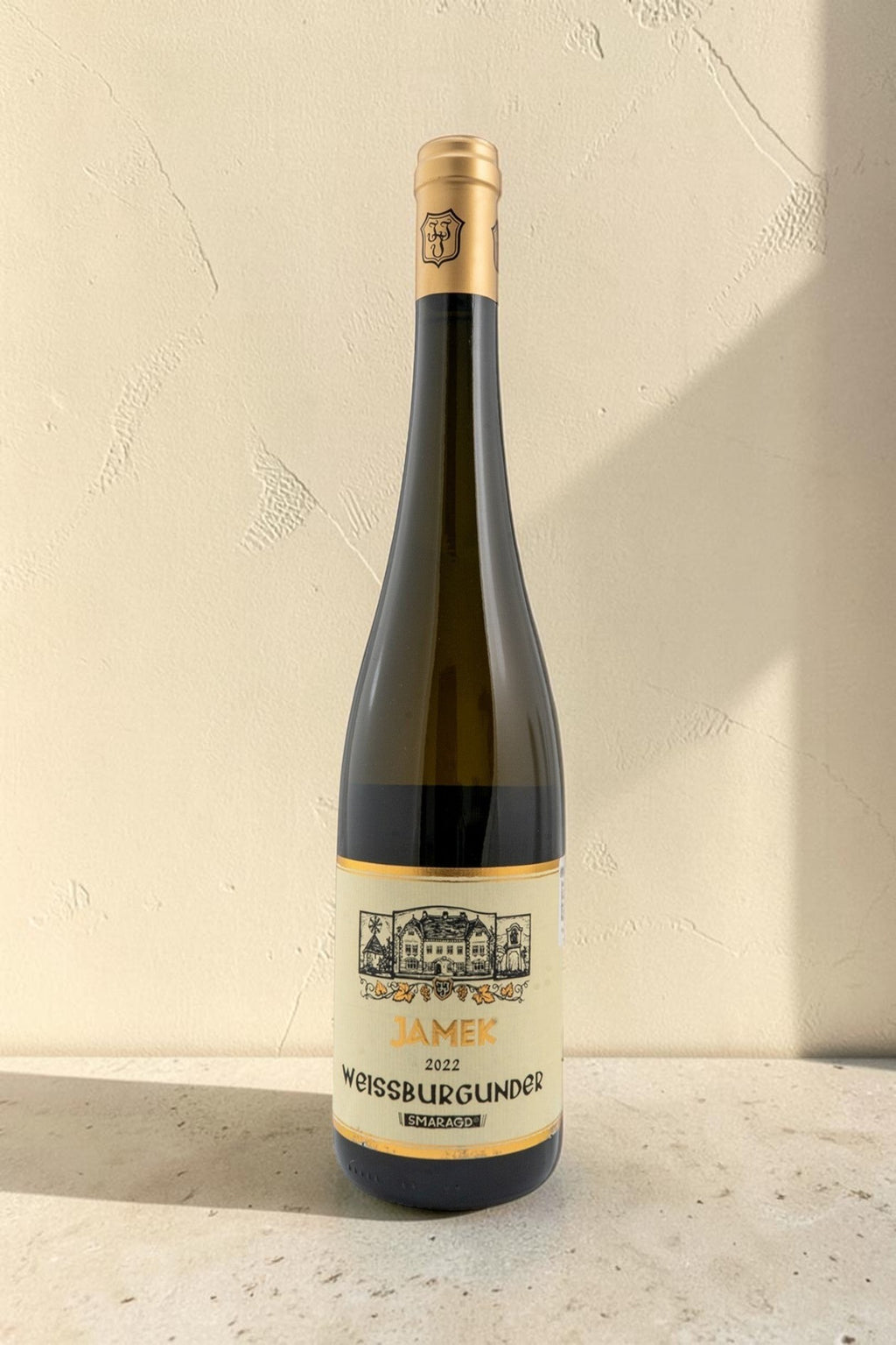 Botella de vino blanco Wellnex Weingut Jamek VB Weissburgunder Smaragd 2022 con etiqueta clásica sobre fondo neutro