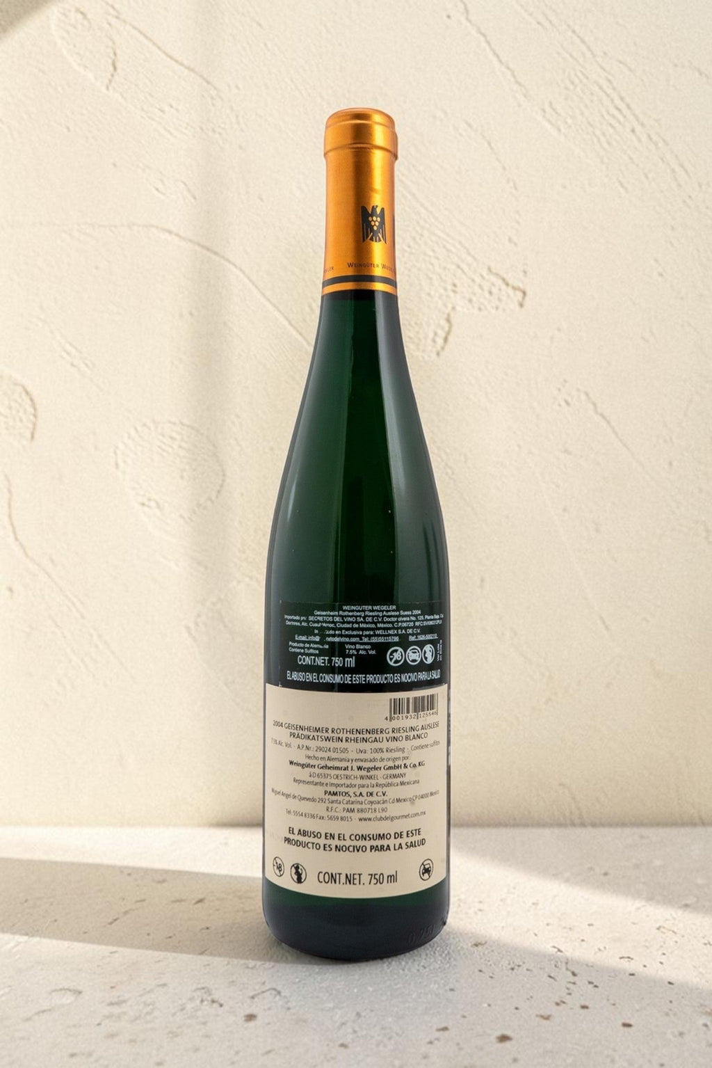Etiqueta trasera de vino blanco Wellnex Weingut Wegeler Riesling Auslese 2004 con detalles técnicos y de importación